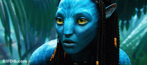 A Close Up Of A Blue Alien With Yellow Eyes GIF