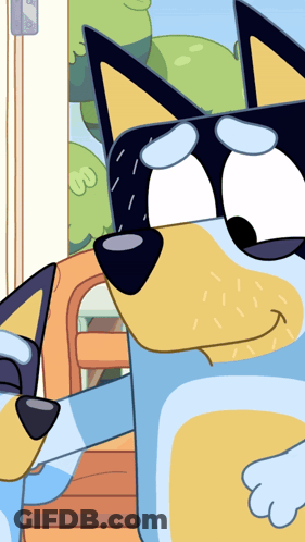 A Close Up Of A Blue And Yellow Cartoon Dog 'S Face GIF
