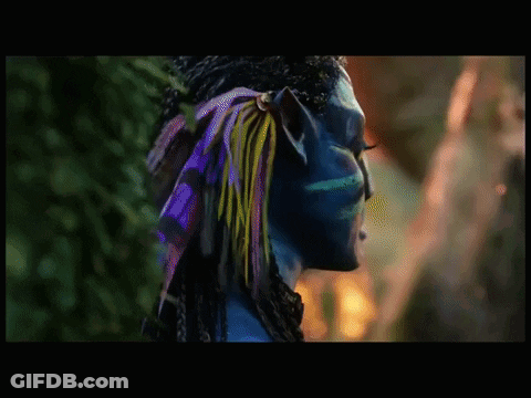 A Close Up Of A Blue Avatar With A Green Eye GIF