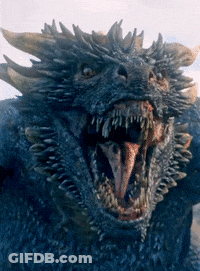 A Close Up Of A Blue Dragon With Its Mouth Open GIF