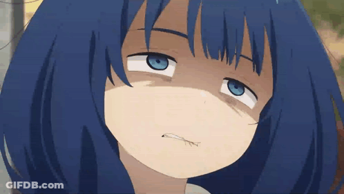A Close Up Of A Blue Haired Anime Girl Making A Funny Face GIF