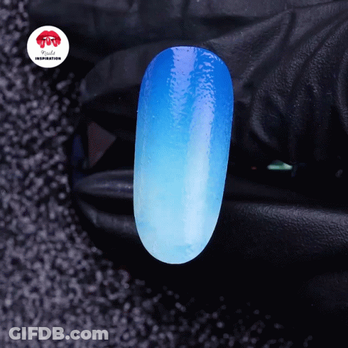 A Close Up Of A Blue Nail With The Words Nails Inspiration On The Corner GIF