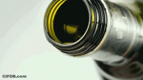A Close Up Of A Bottle With A Label That Says Carlsberg On It GIF