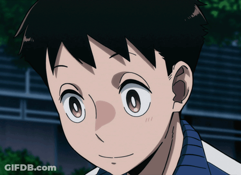 A Close Up Of A Boy 'S Face With A Blue Shirt GIF