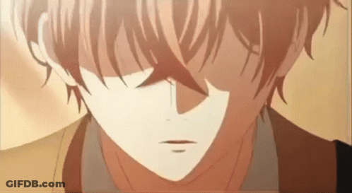 A Close Up Of A Boy 'S Face With A Tear Coming Out Of His Eye . GIF