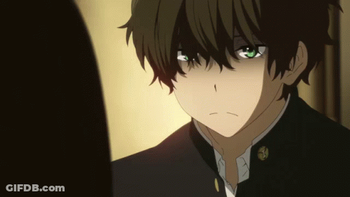 A Close Up Of A Boy With Green Eyes And A Black Jacket GIF