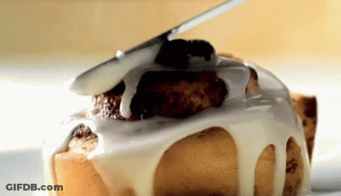 A Close Up Of A Cake With Icing On It GIF