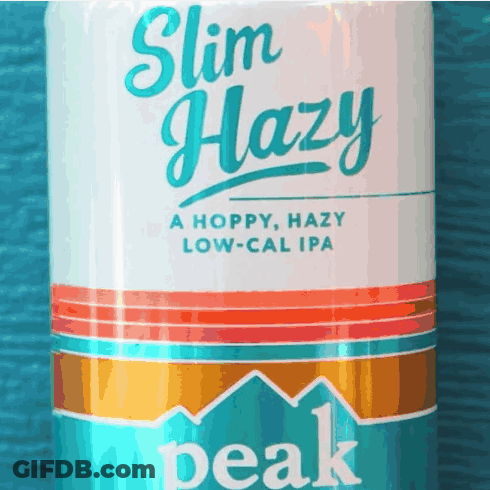 A Close Up Of A Can Of Slim Hazy Peak Beer GIF