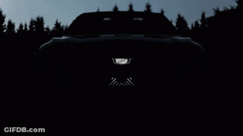 A Close Up Of A Car 'S Front Bumper With A Cadillac Logo On It GIF