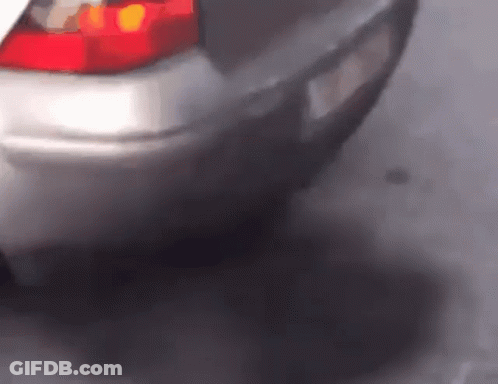 A Close Up Of A Car 'S Tail Light And Exhaust Pipe GIF