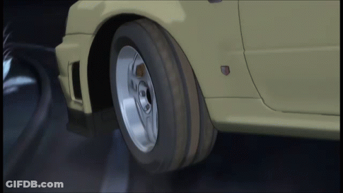 A Close Up Of A Car 'S Wheel With A Badge On The Side GIF