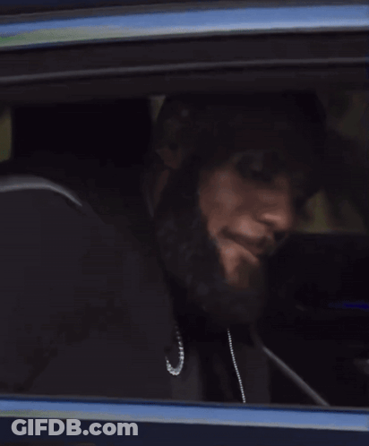 A Close Up Of A Car Window With A Person Looking Out GIF