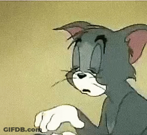 A Close Up Of A Cartoon Cat Holding A Mouse In His Paws . GIF