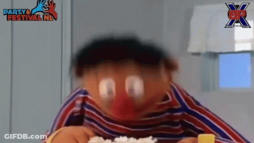 A Close Up Of A Cartoon Character Eating Rice With A Party & Festival Nl Logo In The Background . GIF