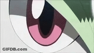 A Close Up Of A Cartoon Character 'S Eye With A Green Leaf On It . GIF