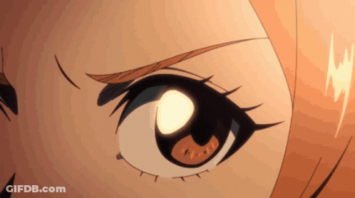 A Close Up Of A Cartoon Character 'S Eye With A Light Shining Through It GIF