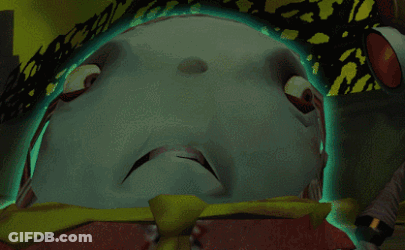 A Close Up Of A Cartoon Character 'S Face With A Green Light Behind It GIF