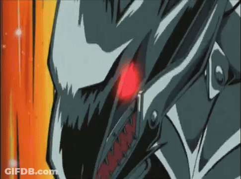 A Close Up Of A Cartoon Character 'S Face With Red Eyes And Sharp Teeth . GIF