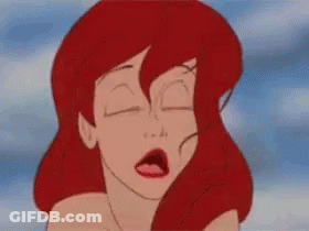 A Close Up Of A Cartoon Character 'S Face With Red Hair . GIF