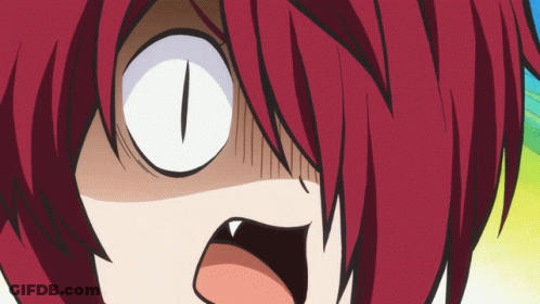 A Close Up Of A Cartoon Character 'S Face With Red Hair And White Eyes GIF