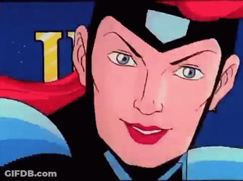 A Close Up Of A Cartoon Character 'S Face With The Letter T Visible In The Background GIF