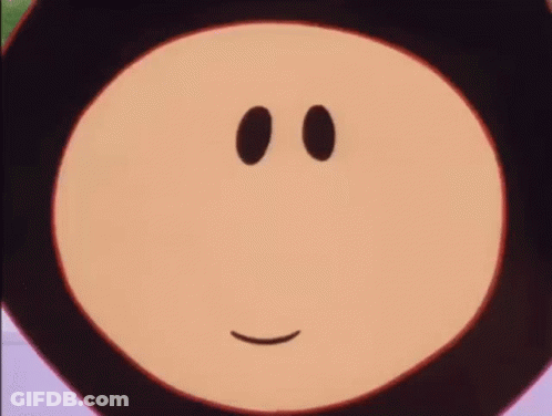 A Close Up Of A Cartoon Character 'S Face With Two Black Eyes And A Smile . GIF