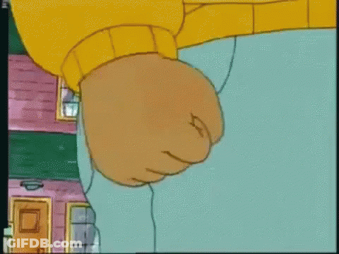 A Close Up Of A Cartoon Character 'S Fist In A Yellow Sweater GIF