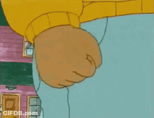 A Close Up Of A Cartoon Character 'S Fist In Front Of A House . GIF