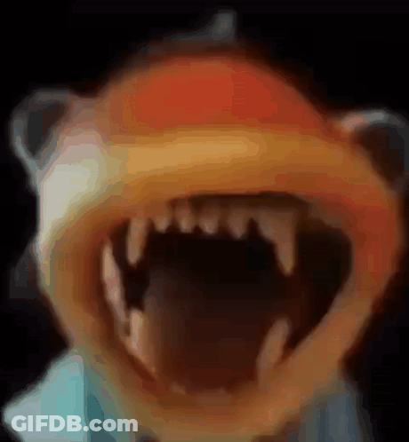 A Close Up Of A Cartoon Character 'S Mouth With Teeth GIF