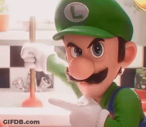 A Close Up Of A Cartoon Character Wearing A Green Hat And Gloves Pointing At Something . GIF