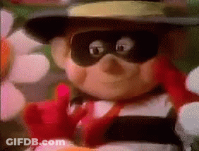A Close Up Of A Cartoon Character Wearing A Hat And Mask . GIF