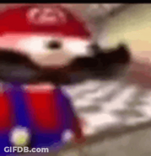 A Close Up Of A Cartoon Character Wearing A Red Hat And A Beard . GIF