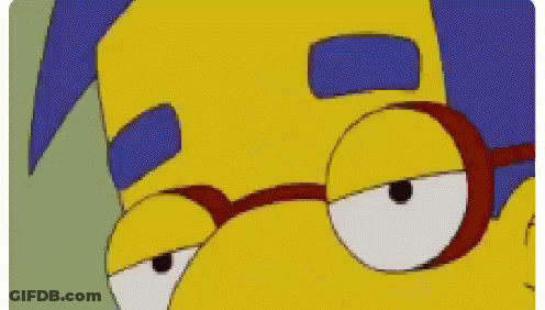 A Close Up Of A Cartoon Character Wearing Glasses And A Blue Haircut . GIF