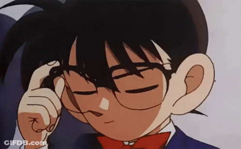 A Close Up Of A Cartoon Character Wearing Glasses And A Red Bow Tie . GIF