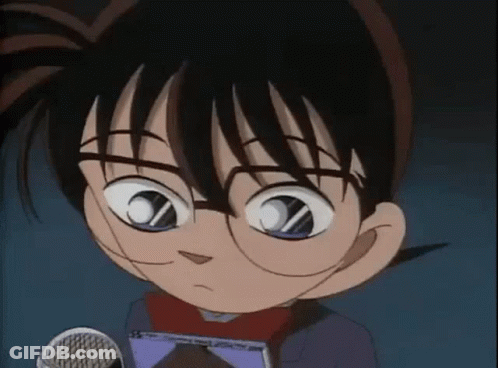 A Close Up Of A Cartoon Character Wearing Glasses Holding A Microphone . GIF