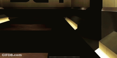 A Close Up Of A Cartoon Character Wearing Sunglasses And A Yellow Superhero Costume GIF