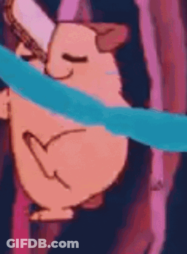 A Close Up Of A Cartoon Character With A Heart On Its Face And A Blue Ribbon Around Its Neck . GIF