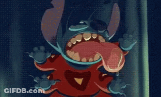 A Close Up Of A Cartoon Character With A Long Tongue Sticking Out GIF