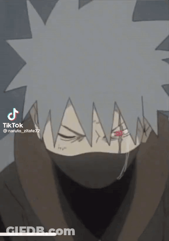 A Close Up Of A Cartoon Character With A Mask On His Face And A Red Eye . GIF