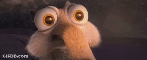 A Close Up Of A Cartoon Character With Big Eyes And A Surprised Look On His Face . GIF