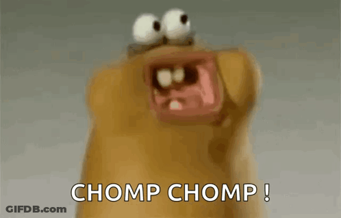A Close Up Of A Cartoon Character With Its Mouth Open And The Words Chomp Chomp Written On The Bottom GIF