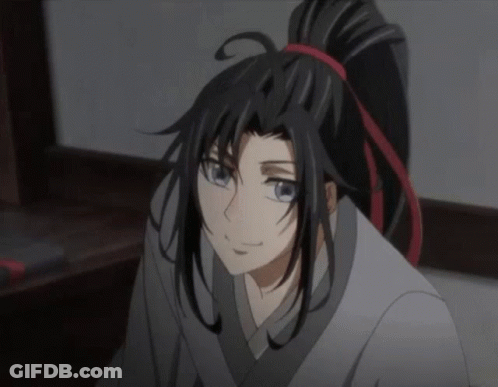 A Close Up Of A Cartoon Character With Long Black Hair And A Ponytail GIF