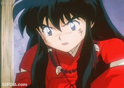 A Close Up Of A Cartoon Character With Long Black Hair Wearing A Red Shirt And A Necklace . GIF