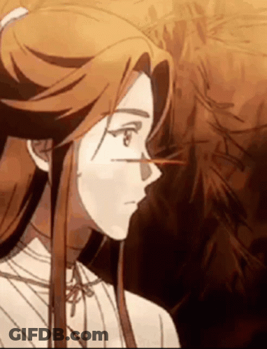 A Close Up Of A Cartoon Character With Long Hair . GIF