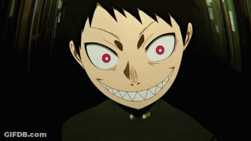 A Close Up Of A Cartoon Character With Red Eyes And Sharp Teeth GIF