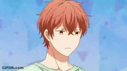 A Close Up Of A Cartoon Character With Red Hair And The Words `` Tsk '' Written On His Face . GIF