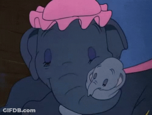A Close Up Of A Cartoon Elephant With A Pink Hat On Its Head GIF