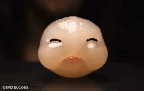 A Close Up Of A Cartoon Face With A Red Mouth GIF