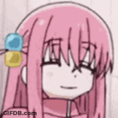 A Close Up Of A Cartoon Girl With Pink Hair . GIF