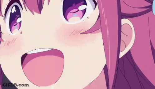 A Close Up Of A Cartoon Girl With Pink Hair And Purple Eyes Smiling . GIF